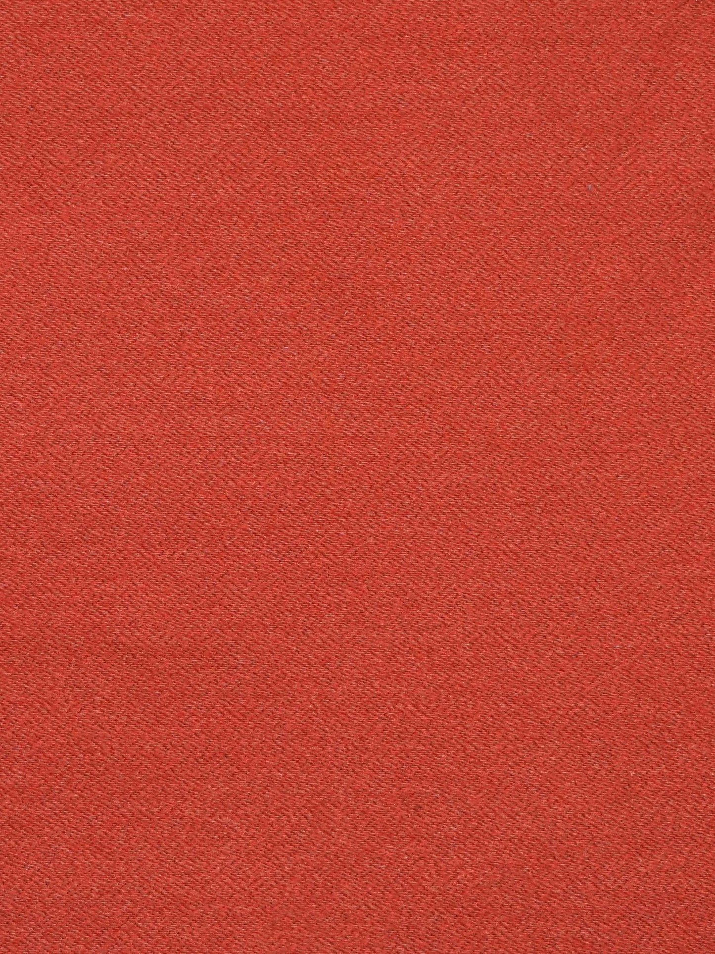 Close-up of burnt orange flannel fabric with a soft nap and fine texture.