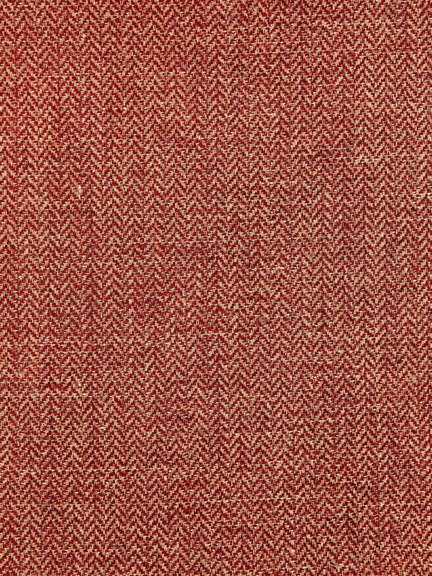Red and beige tweed fabric with herringbone weave; wool blend, textured, ideal for jackets or upholstery.