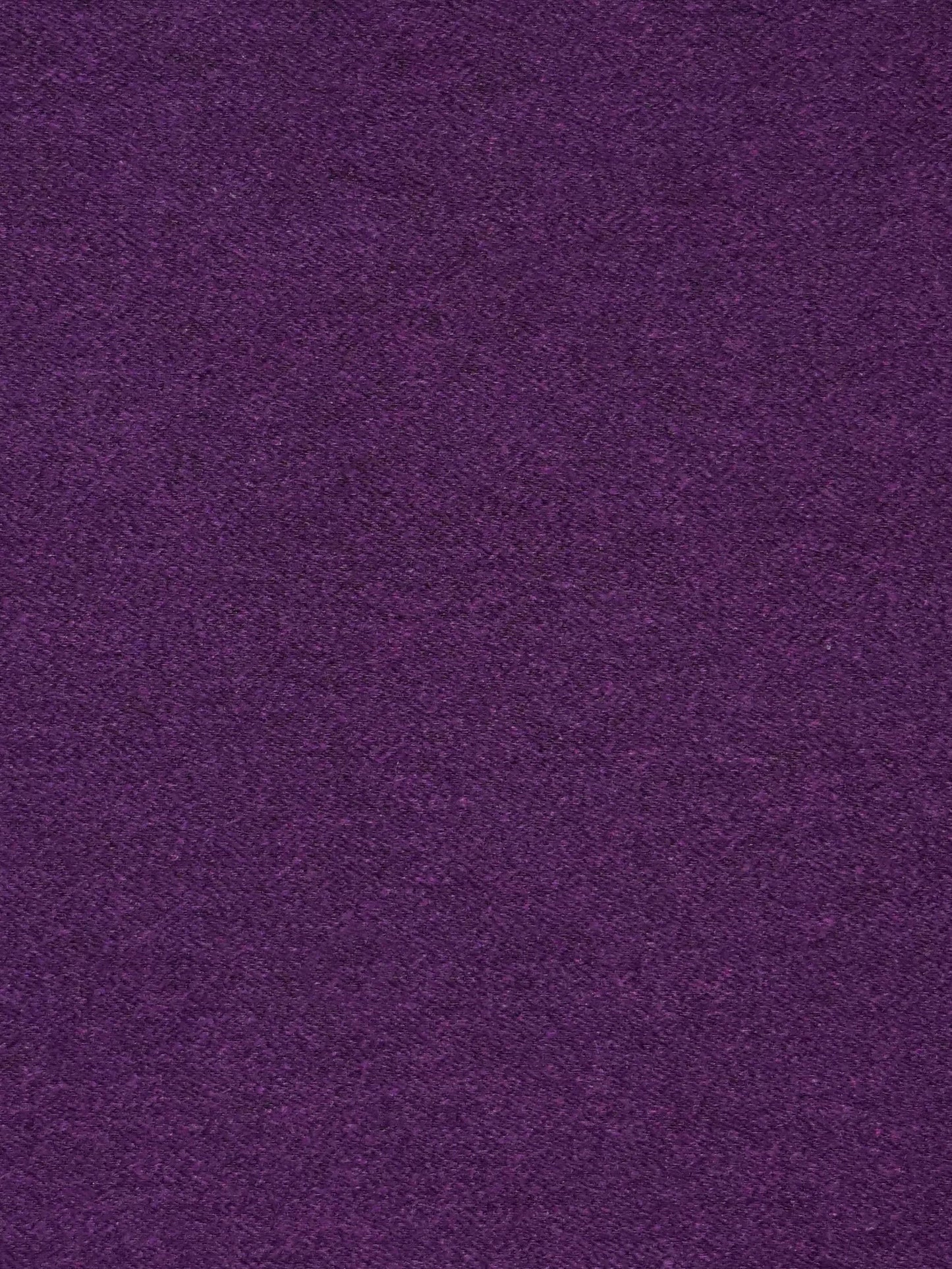 Deep purple velvet-like fabric close-up with soft nap and rich color.