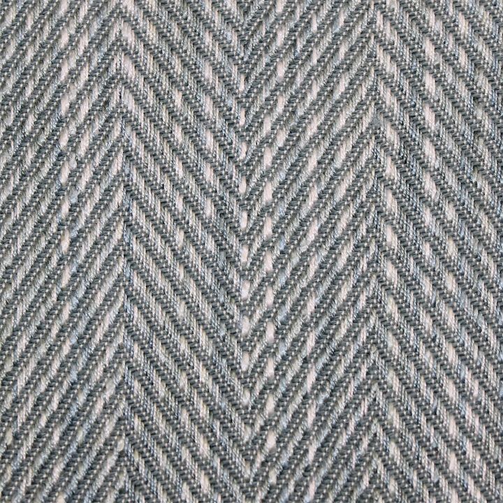 Aqua herringbone tweed fabric close-up with textured diagonal chevron weave, ideal for suits.