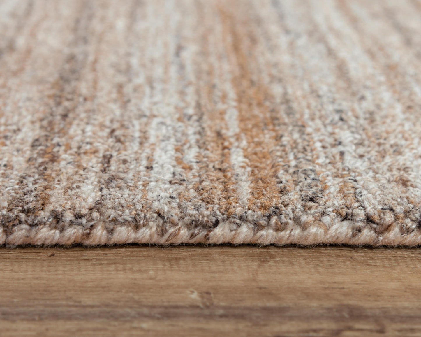 Beige-toned area rug, 9' x 12'.