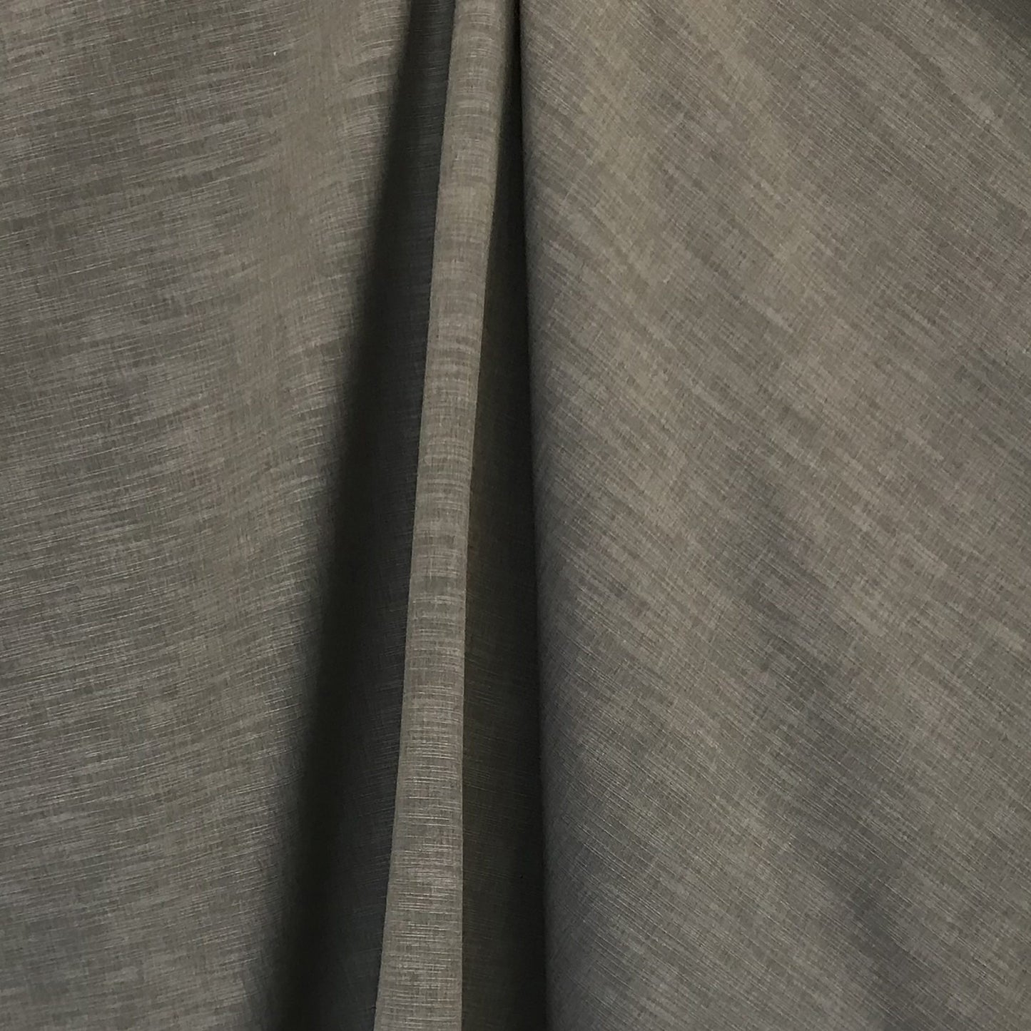 Gray shantung fabric with subtle weave texture, softly draped into curtain-like folds.