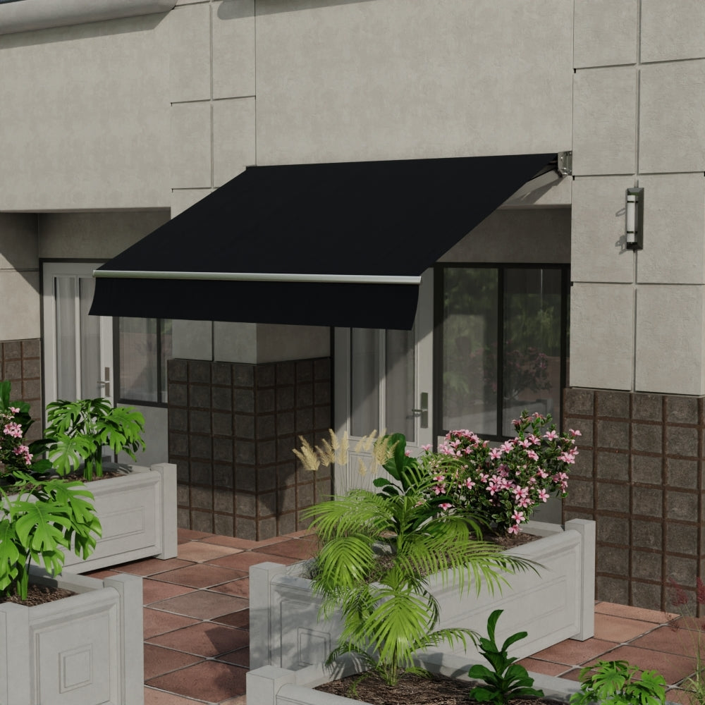 Blue solid fabric shade over glass door on a tiled patio, flanked by white planters with tropical plants and pink flowers.