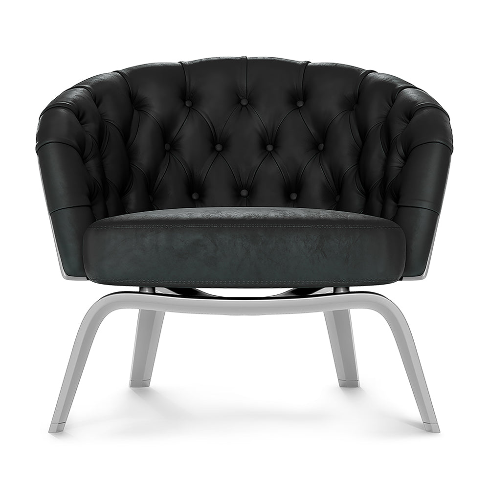 Black fabric barrel chair with rounded back and silver metal sled legs.