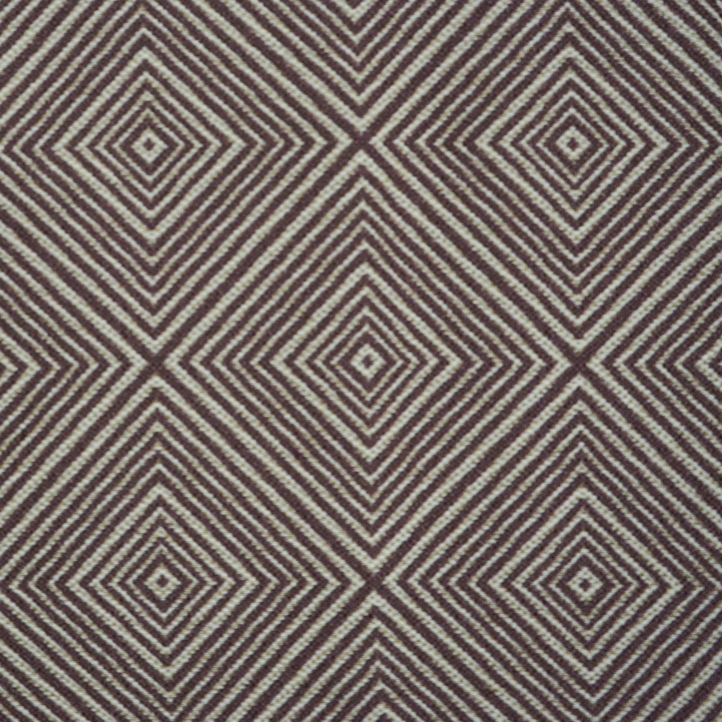 Brown and ivory geometric fabric with concentric diamond shapes.