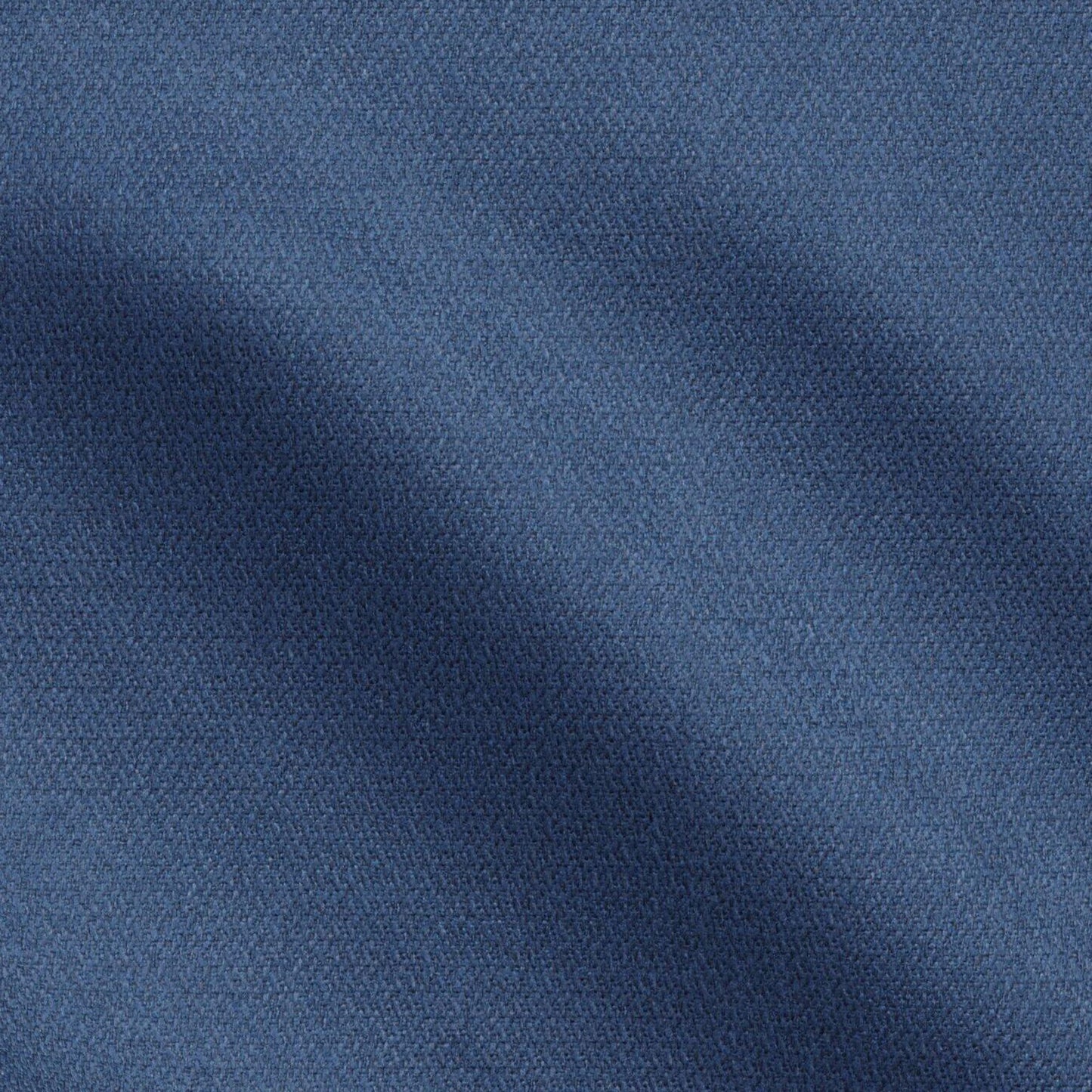 Close-up of navy blue textured fabric with a visible weave and subtle shadows.