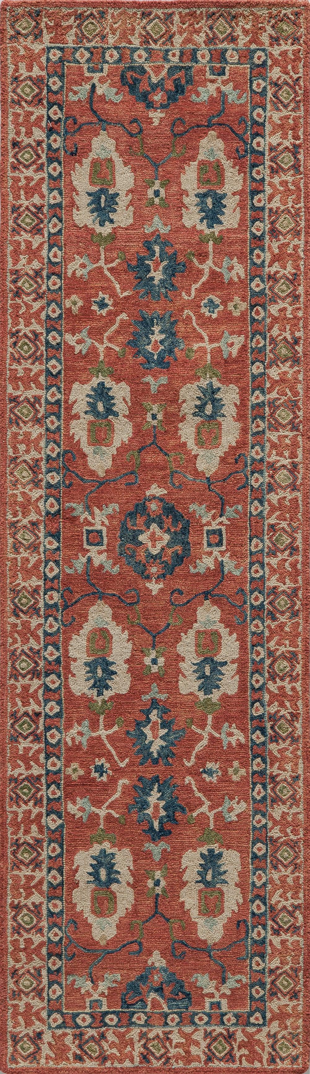 Tangitan red runner rug with blue, ivory and green floral motifs and geometric borders.