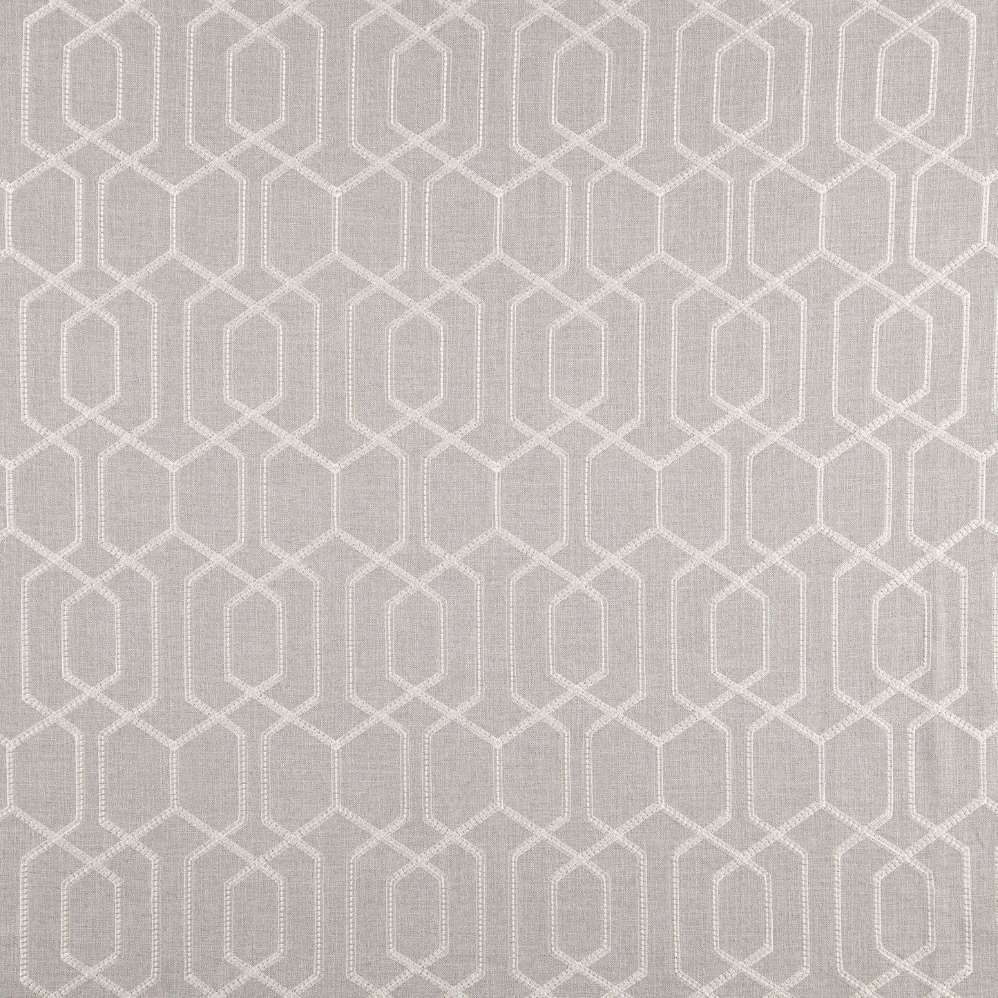 Grey/silver fabric with a cream geometric lattice of interlocking hexagon frames.