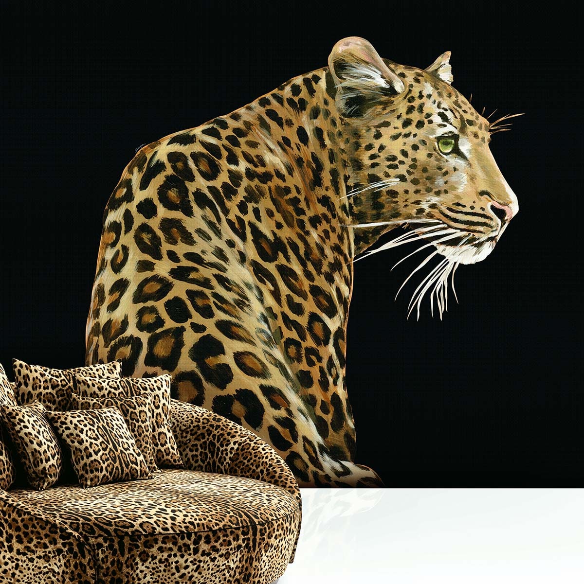 Leopard wall mural: giant leopard on black backdrop beside a curved leopard-print sofa with cushions.