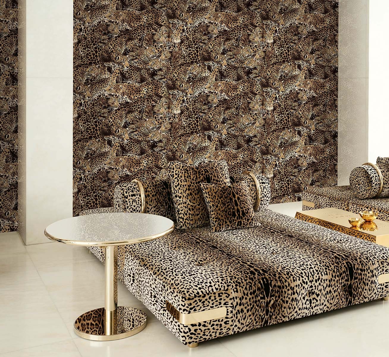 Leopard print sectional sofa with matching cushions in a luxe living room, with a round white-top gold-base side table.