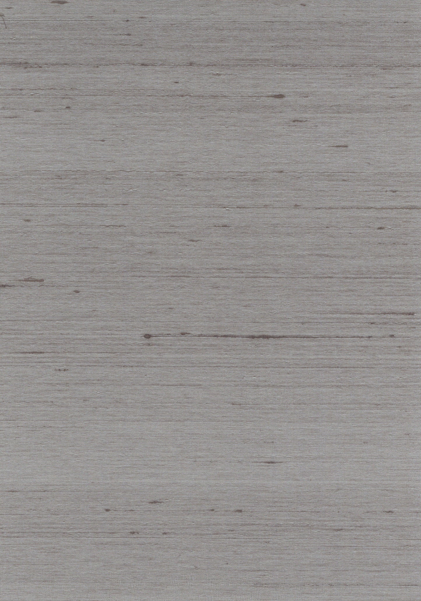 Grey-washed wood plank surface with subtle grain and weathered finish.