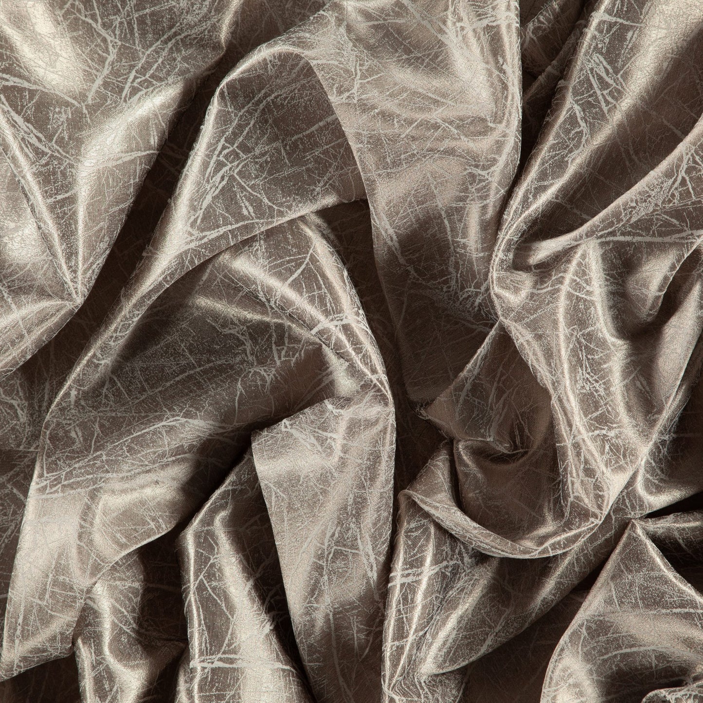Taupe, gold and gray abstract metallic fabric with sheen; sheer, wide-width, reversible, draped with folds.