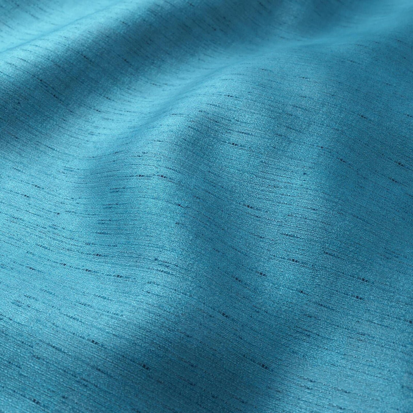 Crepe fabric with blue aqua strie texture and soft drape.