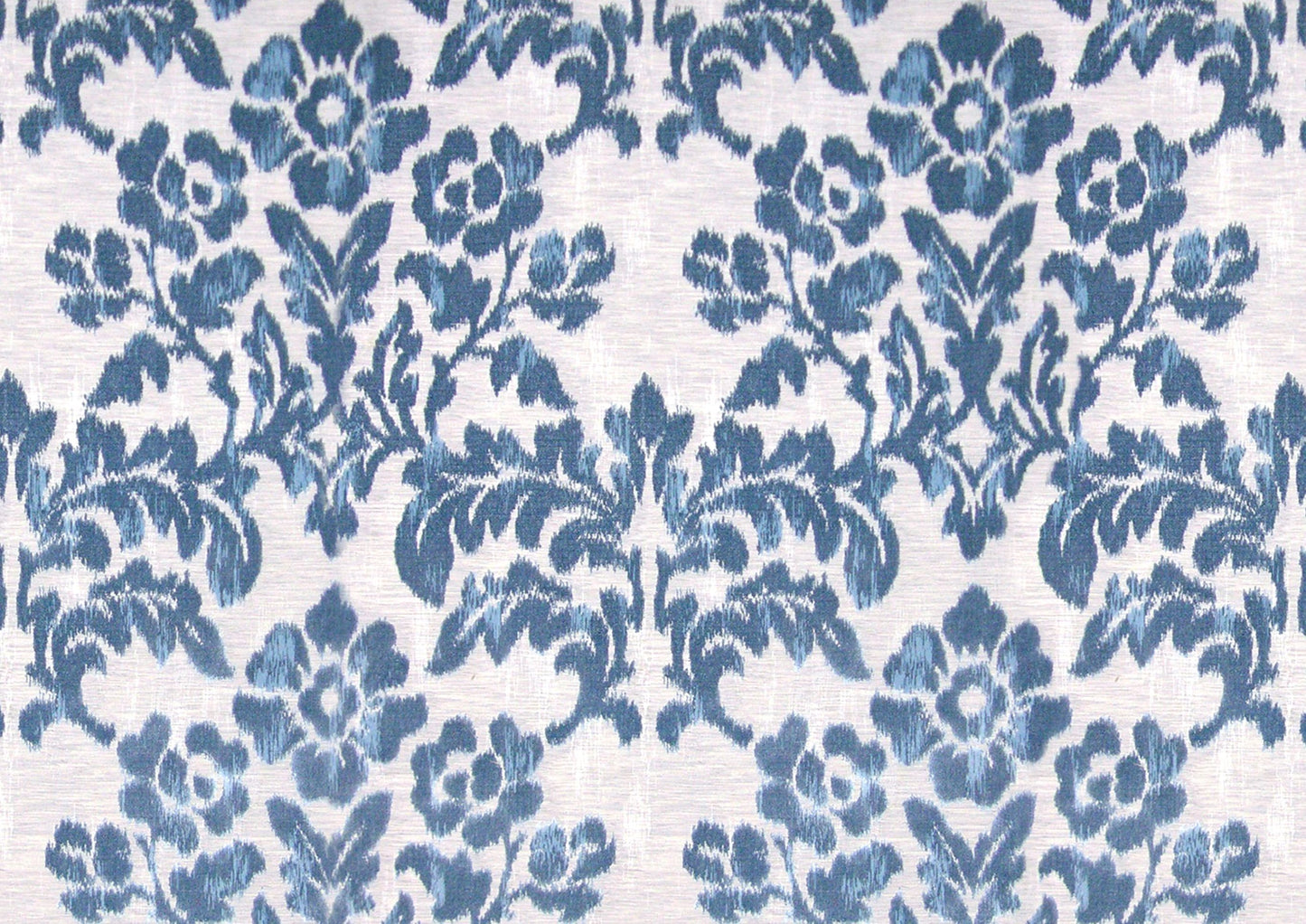 Blue damask floral pattern on cream textile, ornate vintage-style fabric suitable for upholstery or curtains.