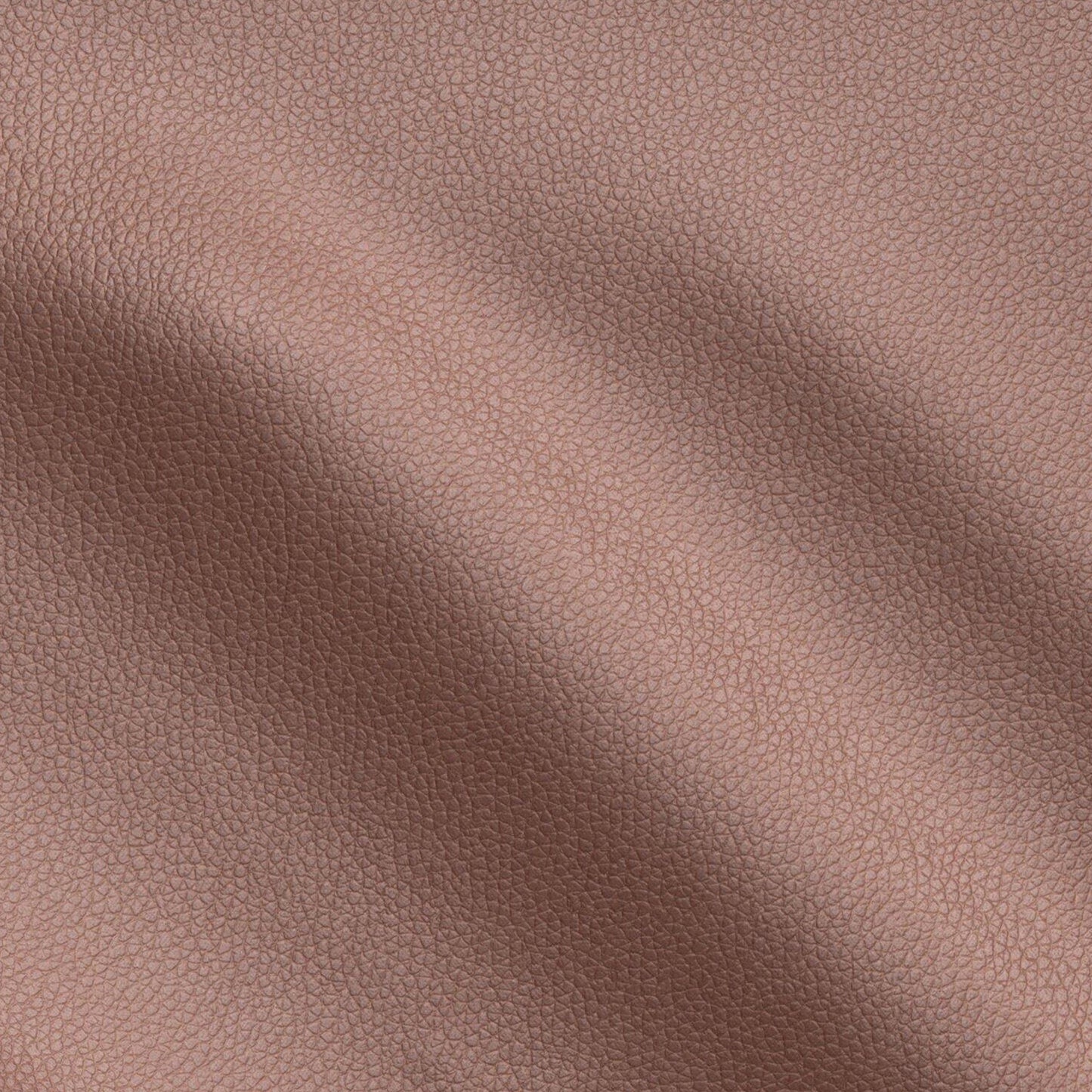 Close-up of brown pebbled vegan leather texture with subtle folds and warm tan grain.