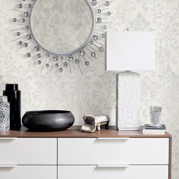 Silver-grey metallic damask wallpaper pattern.