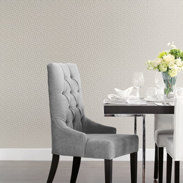 Silver grey wallpaper with a metallic star geometric pattern.
