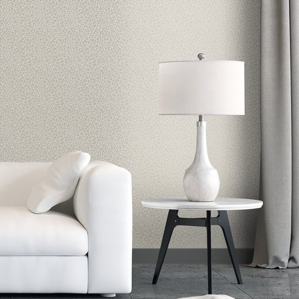 Silver-grey metallic wallpaper with a geometric crazed geo pattern.