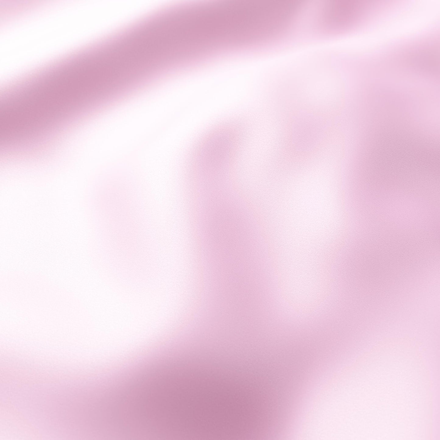 Blush pink sateen fabric with soft folds and subtle sheen; ideal for gowns, linens or decor.