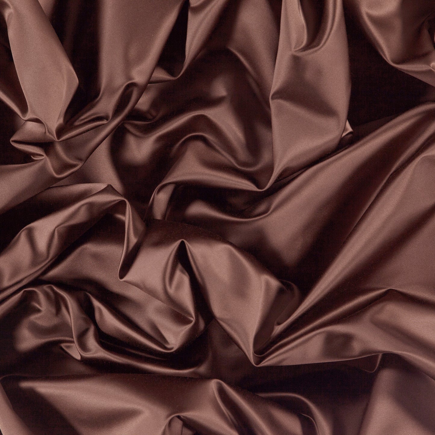 Brown sateen fabric with glossy sheen and flowing, draped folds.