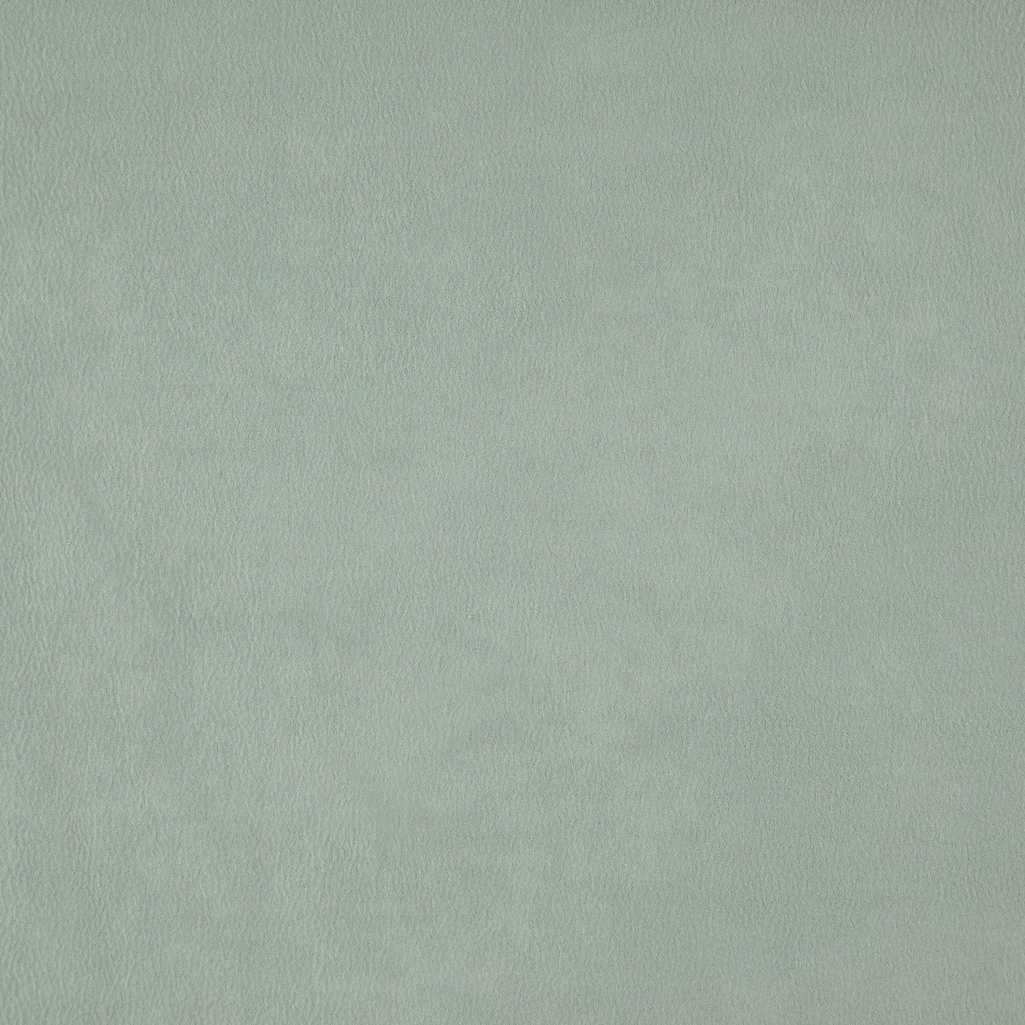 Close-up of blue faux suede texture with soft nap and subtle color variation.