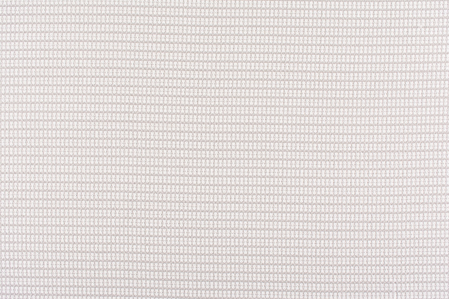 Beige textured woven fabric close-up with tiny grid pattern; soft, neutral upholstery material.