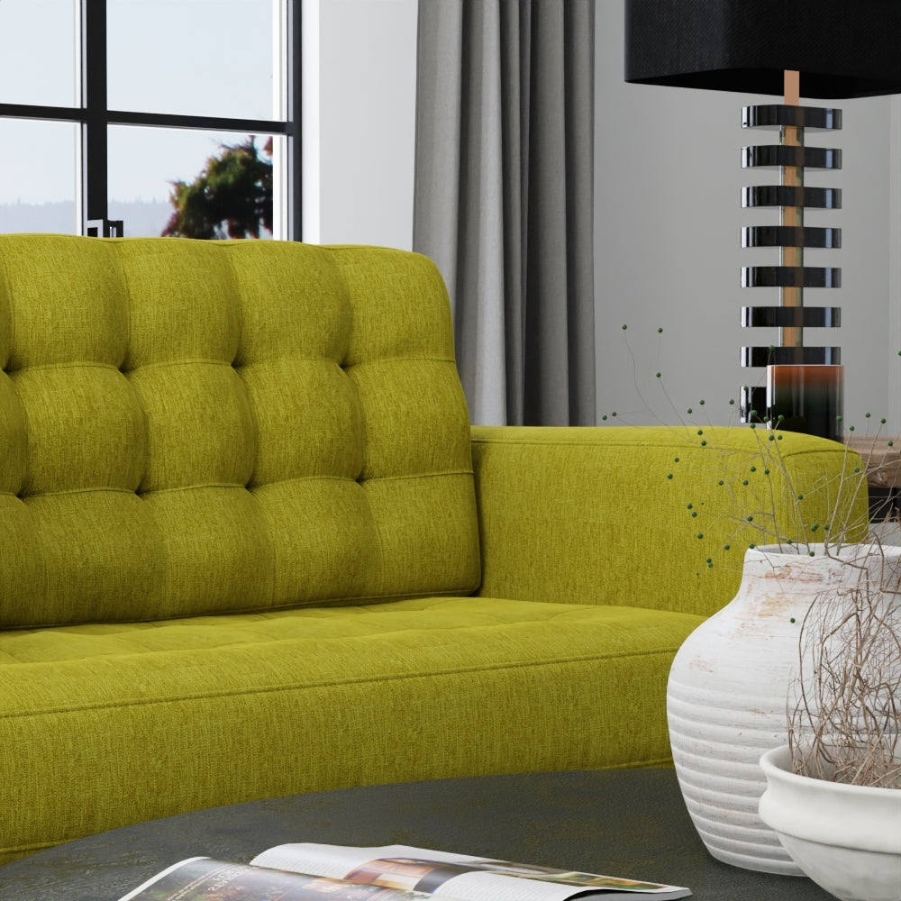 Lemongrass solid fabric swatch in a modern living room with a large window, grey curtains, striped lamp and decorative vases.