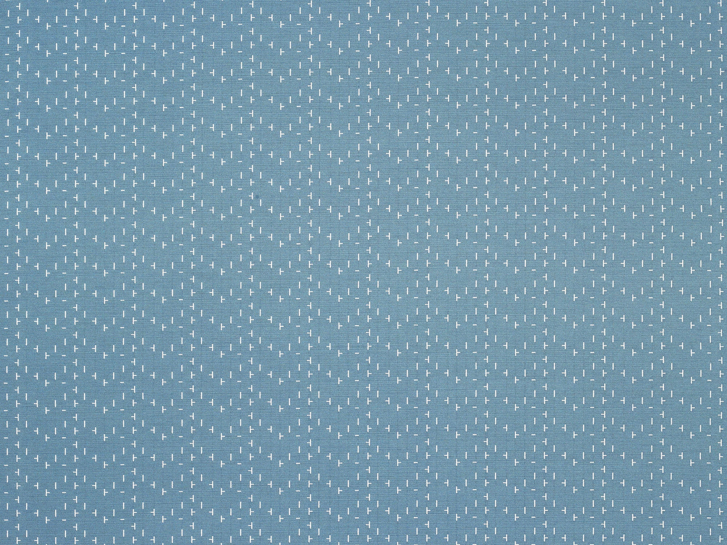 Blue-gray fabric with tiny white dashes in a repeating geometric pattern; versatile for upholstery, curtains or clothing.