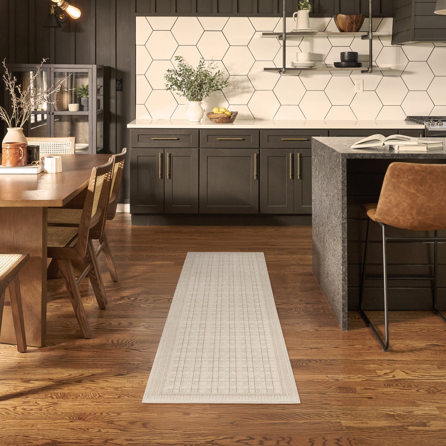 Cream woven runner rug with a subtle grid pattern on hardwood kitchen floor, modern farmhouse style