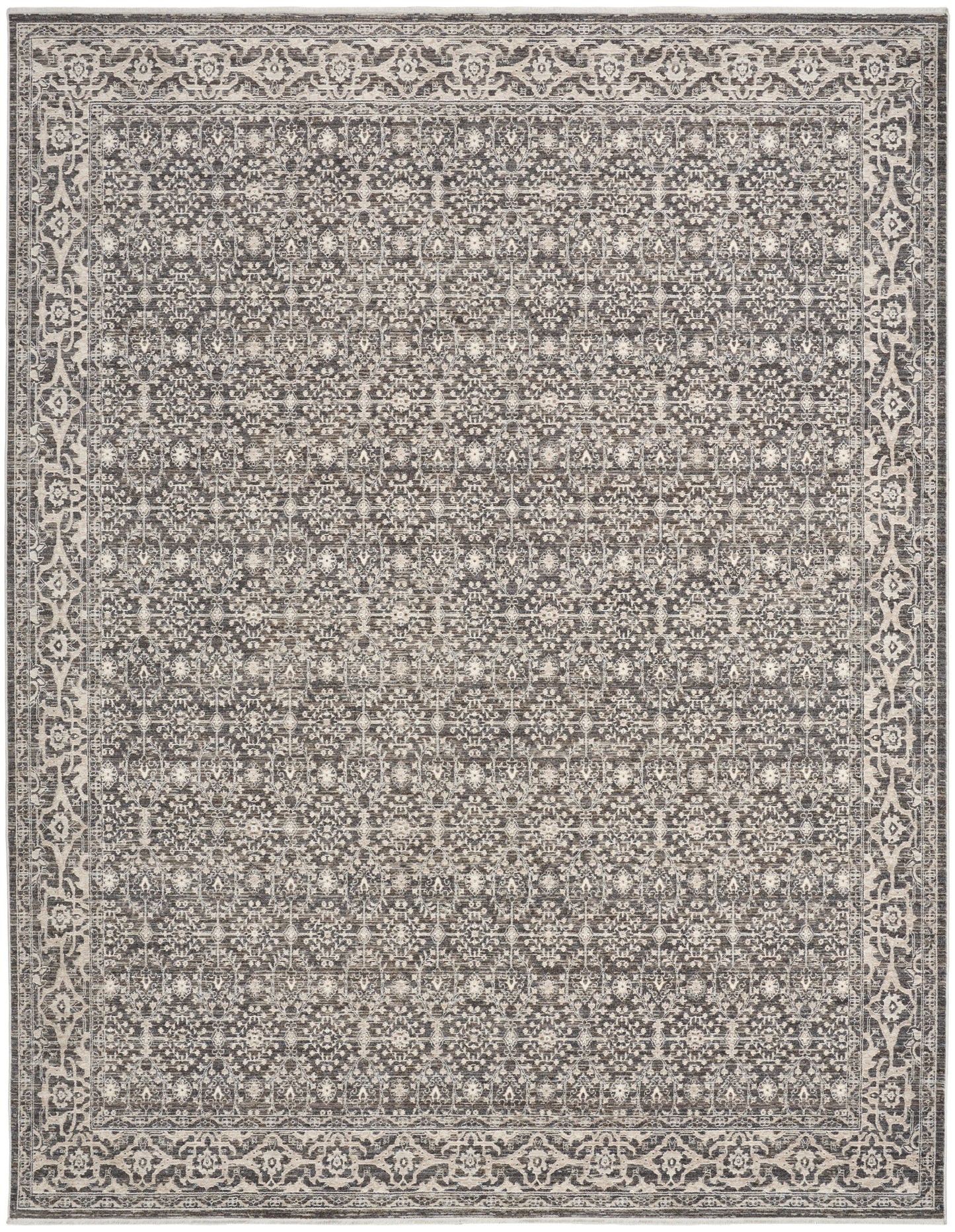 Gray and ivory rectangular area rug with dense geometric floral pattern and ornate border; vintage distressed look.