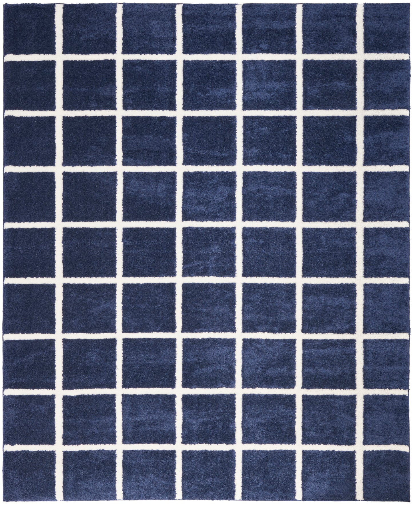 Navy blue rectangular rug with bold white grid lines; modern geometric area rug.