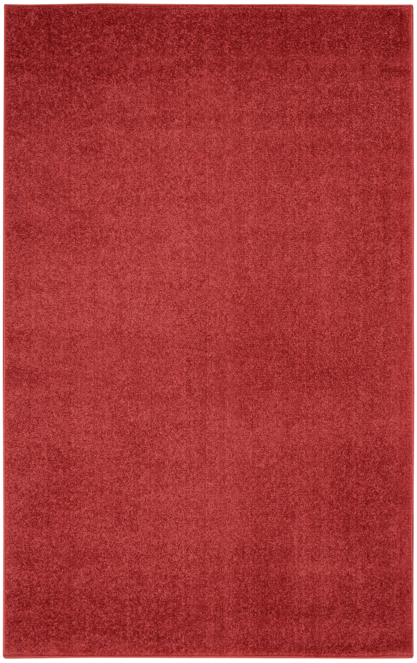 Red rectangular area rug with plush texture and solid deep red color.
