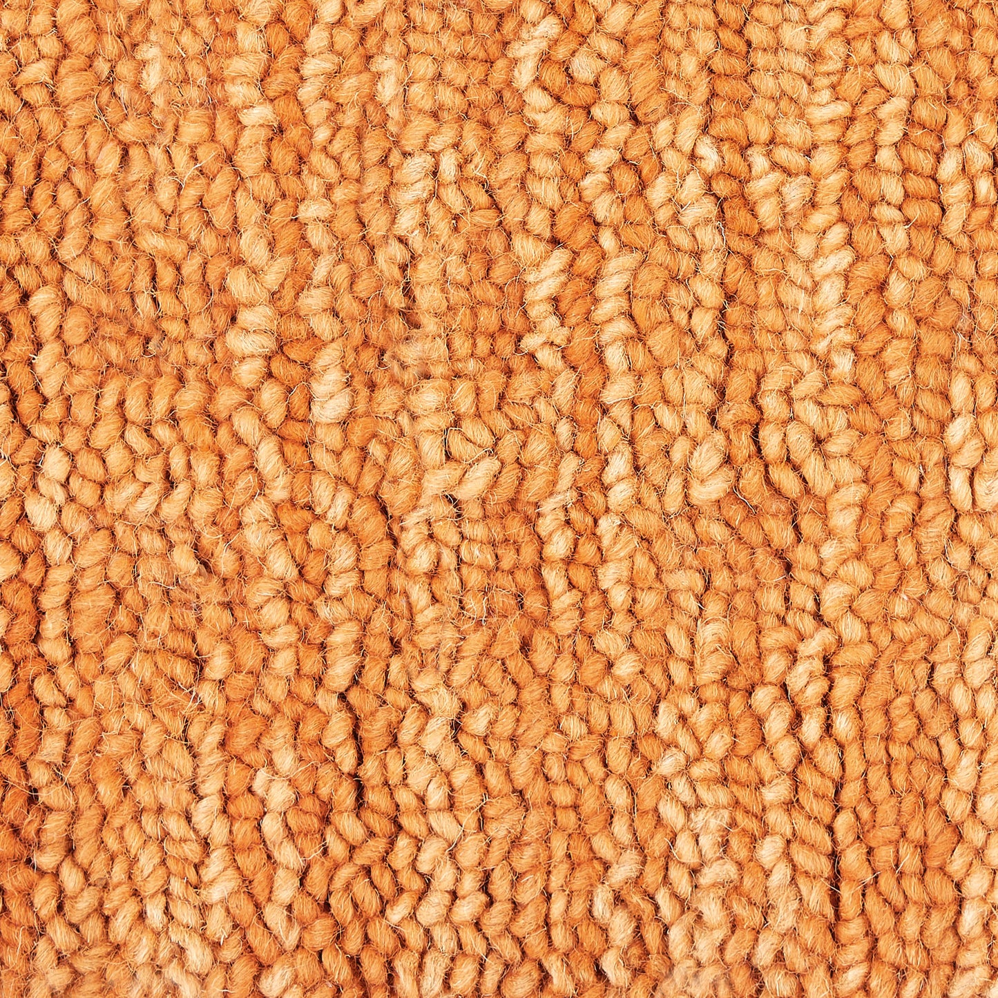 Orange loop-pile carpet close-up with thick, textured fibers for a cozy home rug.
