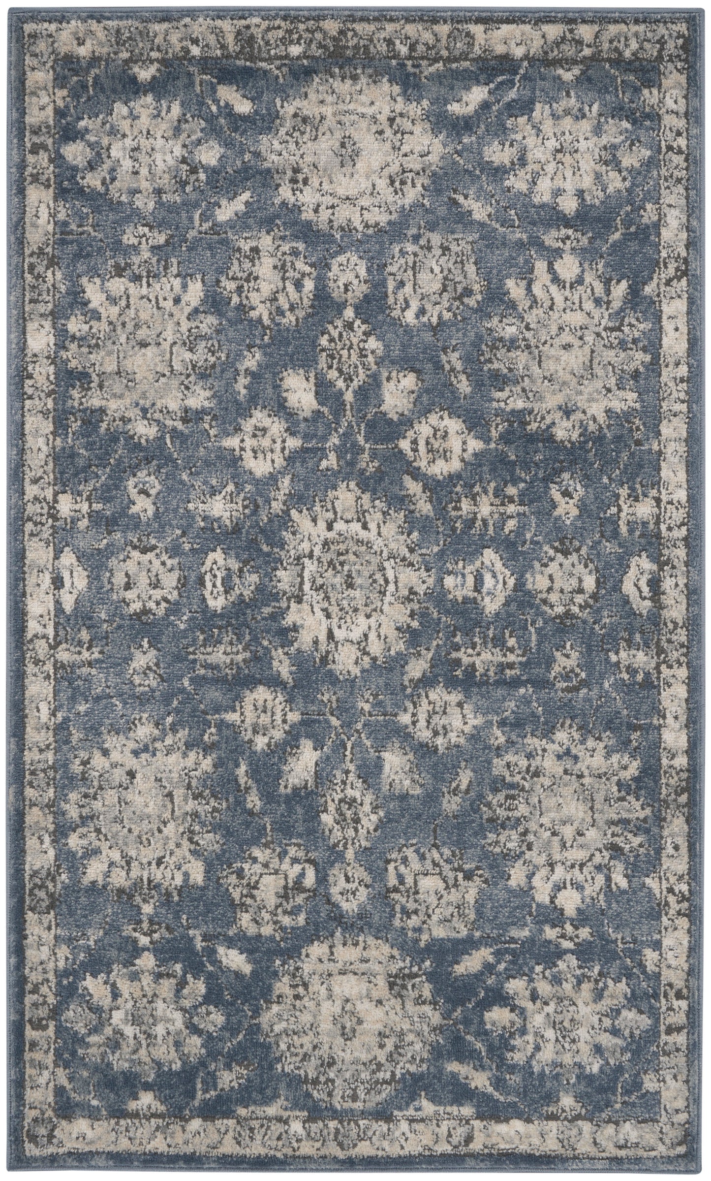 Blue distressed traditional area rug with ivory floral medallions & a light border; vintage-inspired decor.