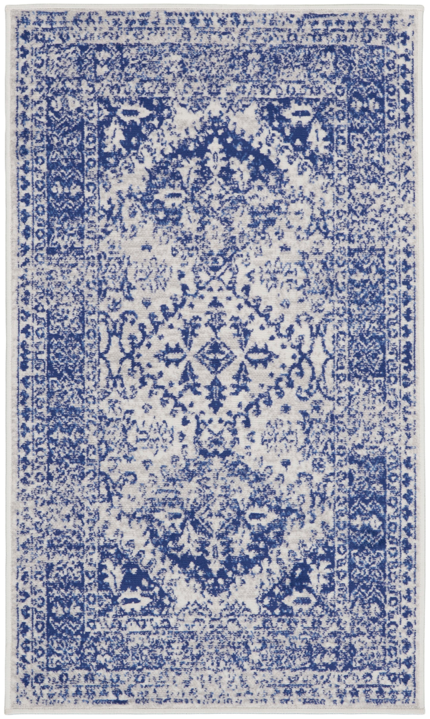 Blue & white distressed oriental rug with central medallion, floral patterns, and bordered edges.