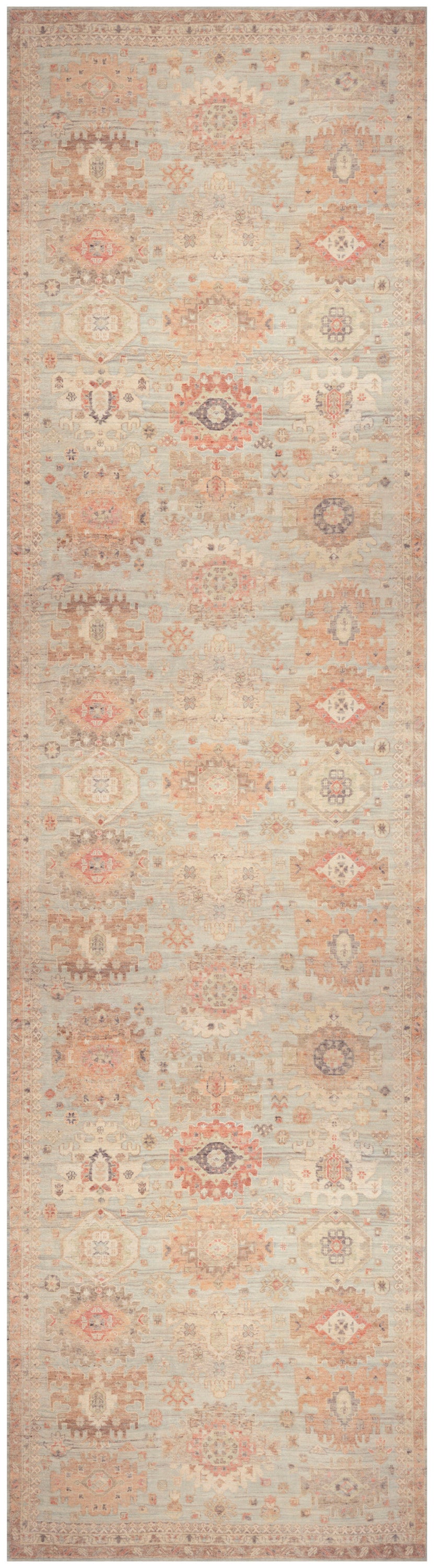 Long hallway runner rug in dusty pink and cream with soft blue accents, faded oriental medallions, vintage distressed look.