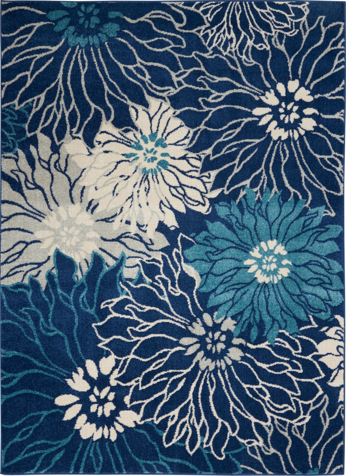 Blue area rug with oversized white and teal floral blooms and bold linework for a modern tropical look.