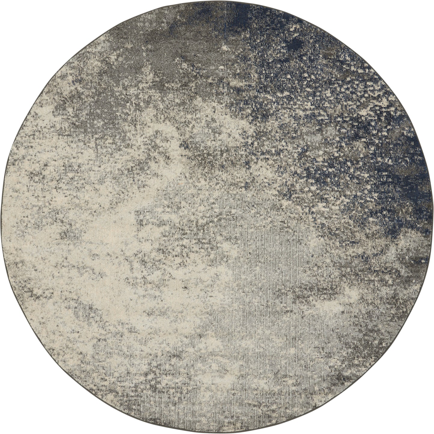 Round rug with abstract distressed gradient in beige, cream, gray and navy, textured contemporary style.