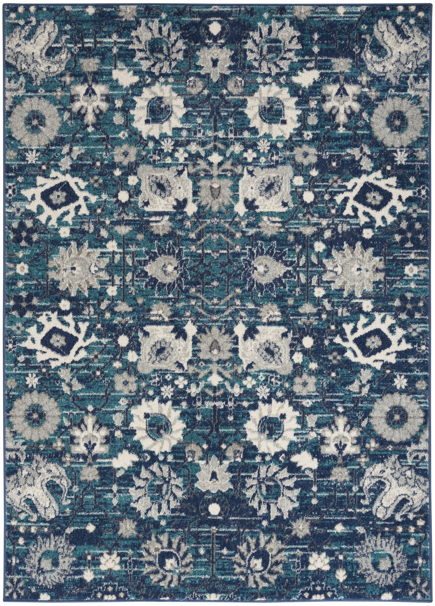 Rectangular area rug in teal, navy & cream with distressed oriental floral motif and medallion pattern.