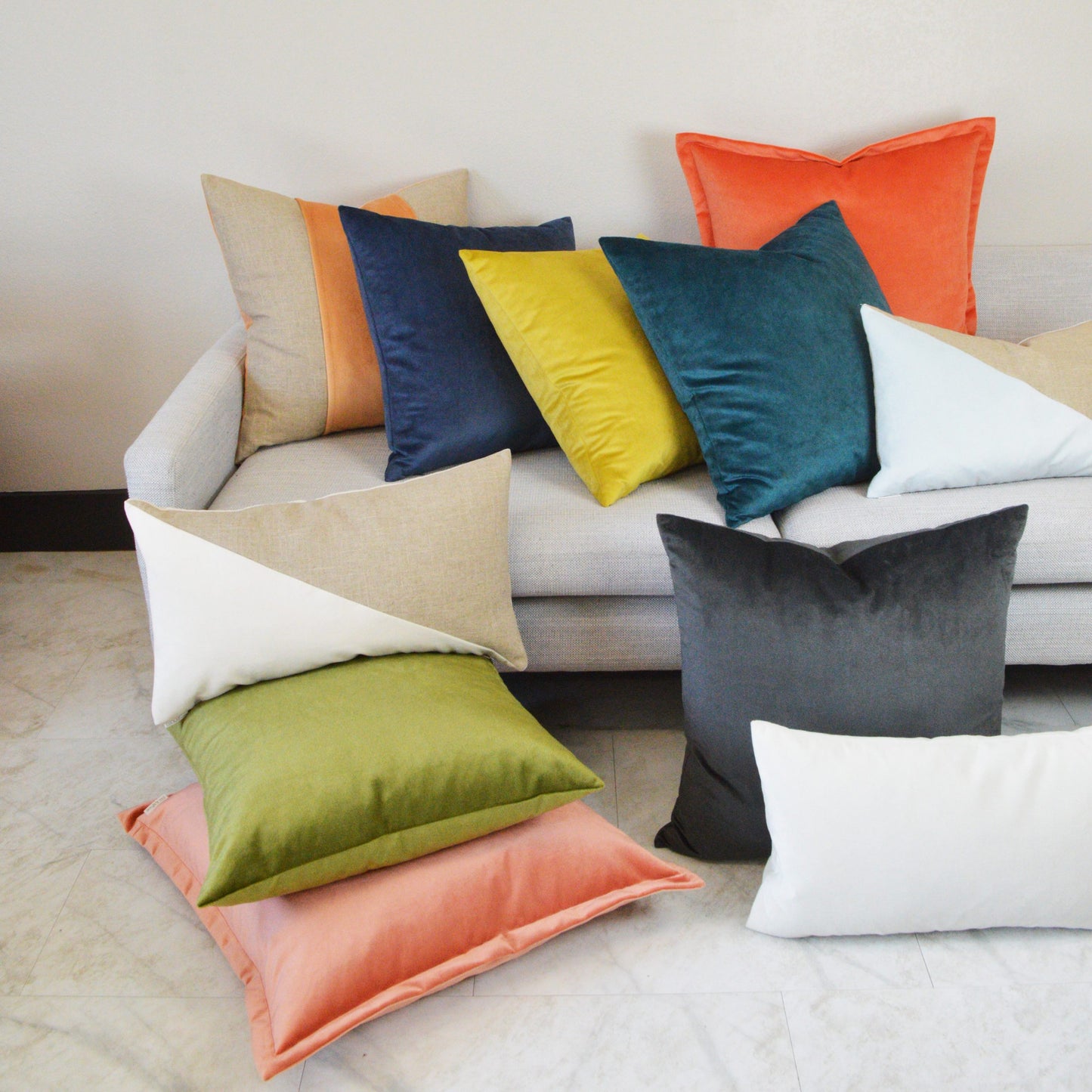 Ivory color-block Jefferson lumbar pillow, 14" x 24", on a light gray sofa.