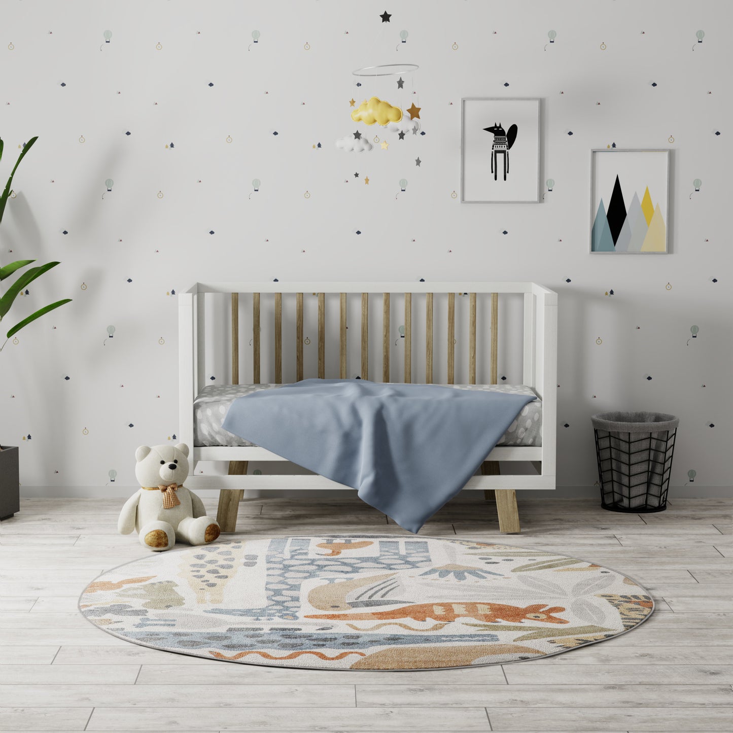 Round pastel kids' rug on the floor, with a teddy bear nearby, a small basket, and framed mountain art in the background.