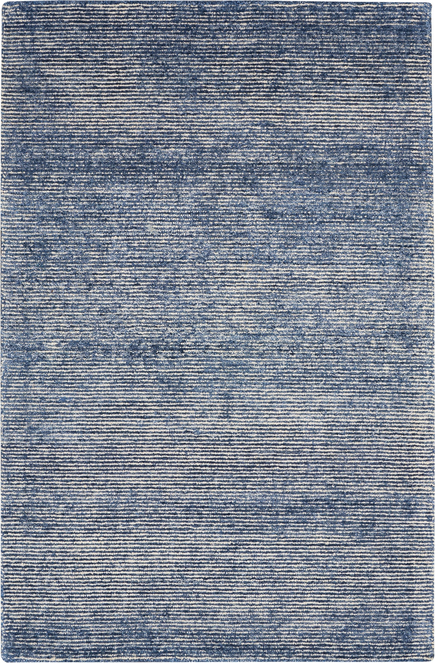 Blue flatweave area rug with subtle heathered texture and horizontal striations in navy and light blue tones.