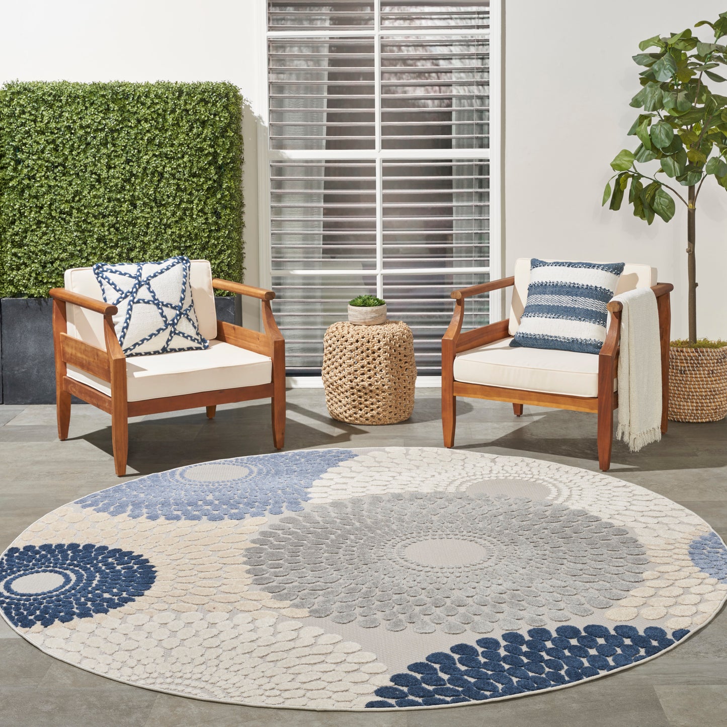 Round blue-gray rug, 8 ft diameter.