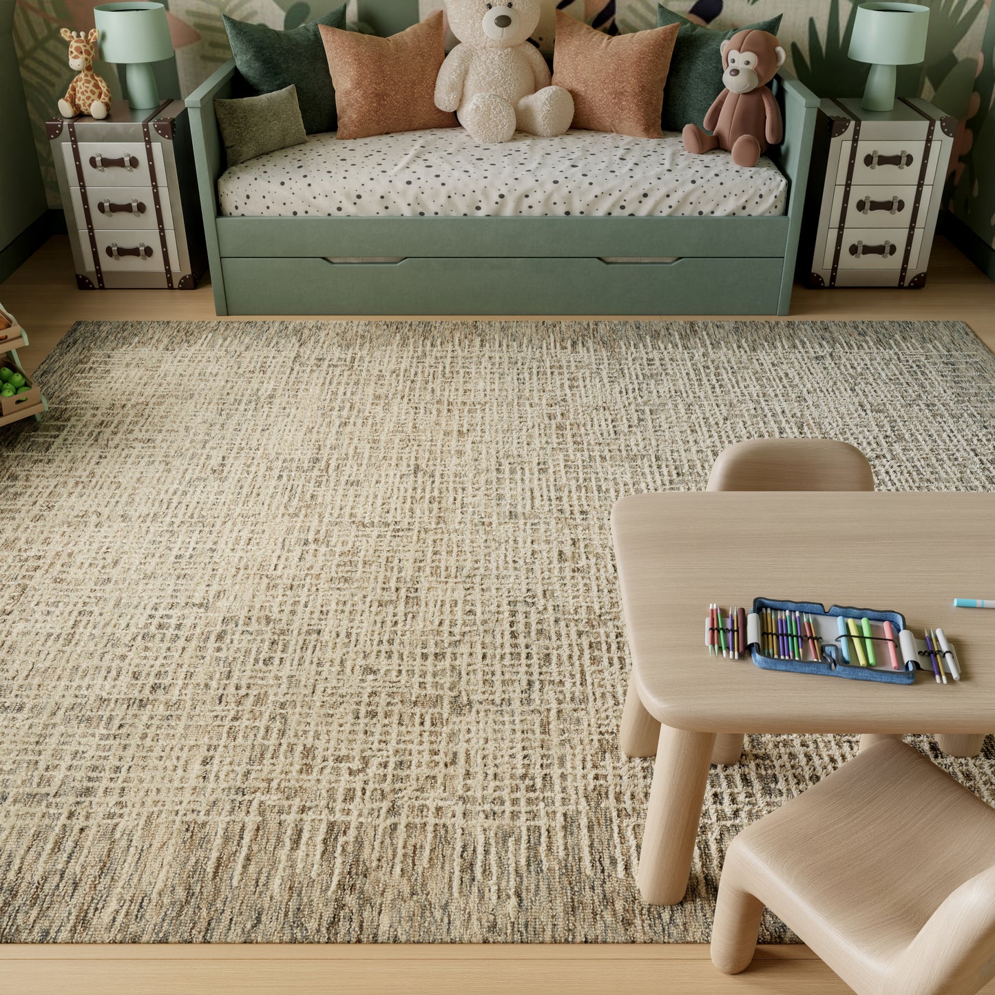 Mint green kid's daybed with built-in drawers, plush toys, beige speckled rug, and a light wood table with colored pencils.