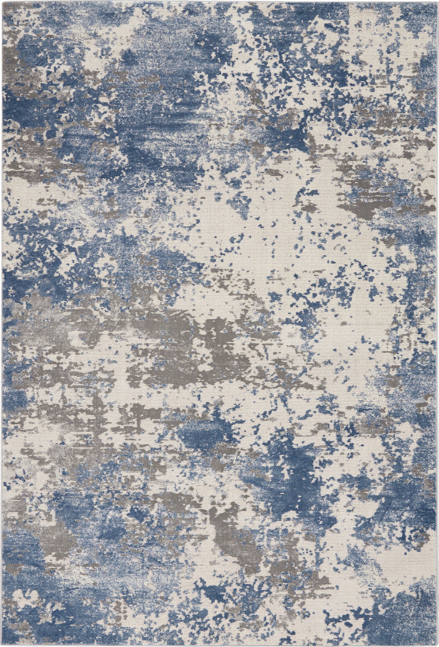 Abstract blue and taupe patterned area rug with beige base and painterly splatters