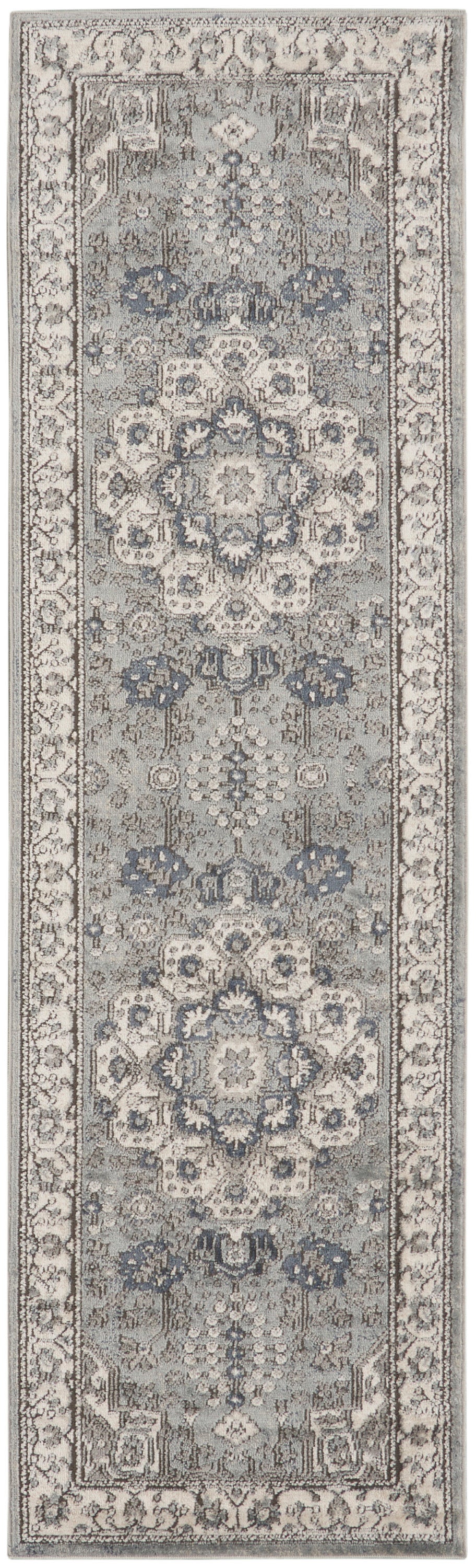 Grey-beige oriental runner rug with blue floral medallions and an ornate border in traditional style.
