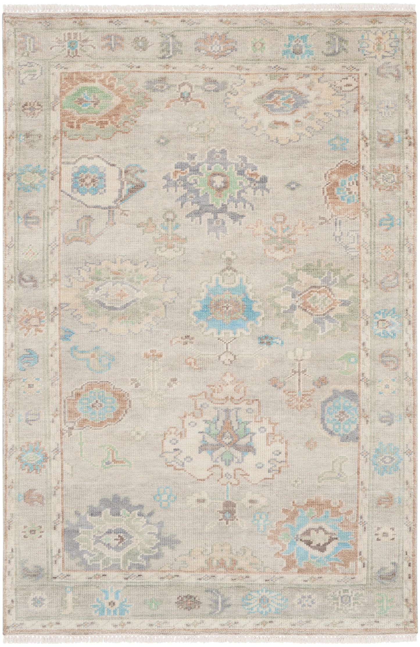 Beige oriental rug with pastel blue and teal floral medallions; intricate border and fringed ends.