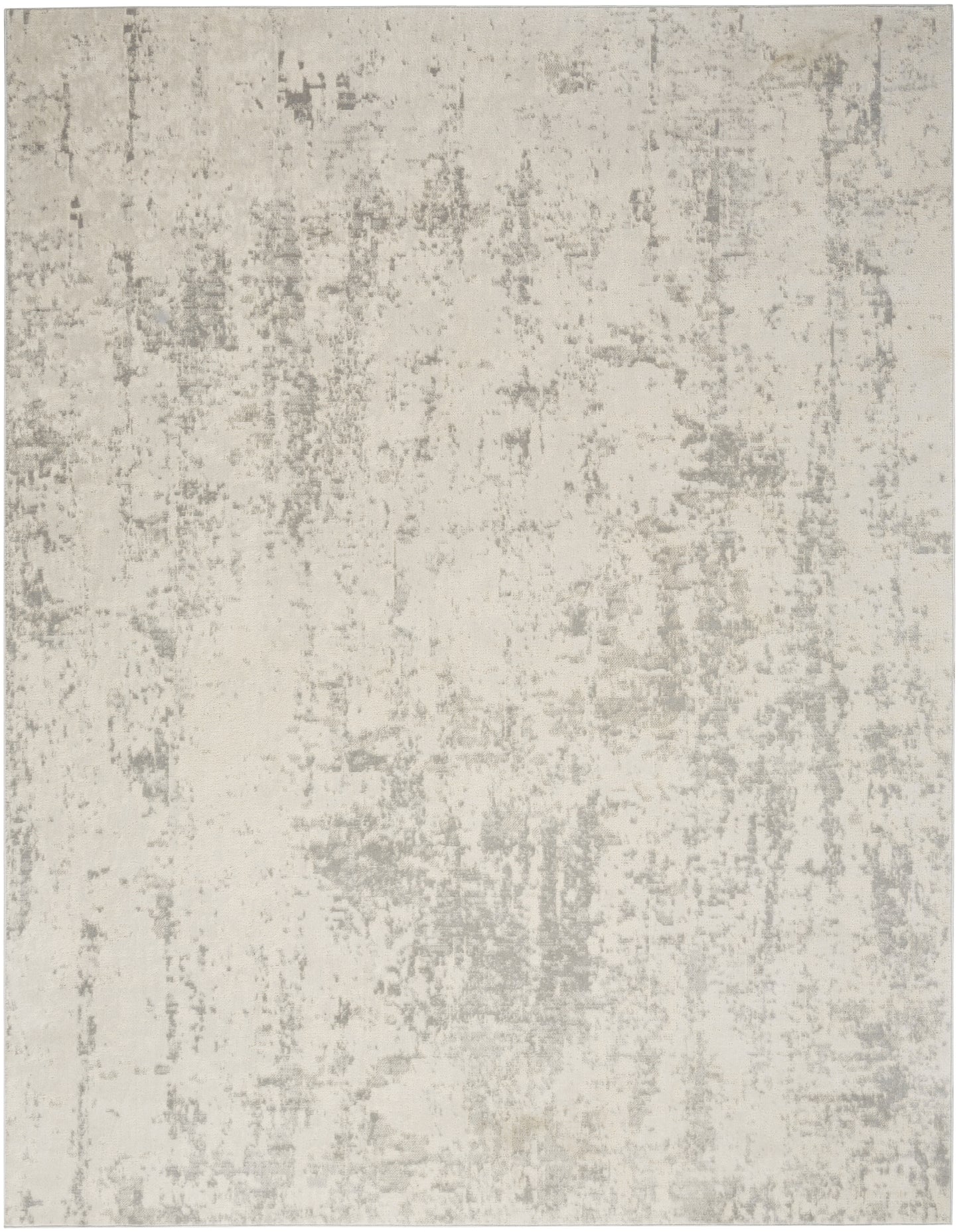 Cream and light gray abstract distressed area rug with soft, low-pile texture.