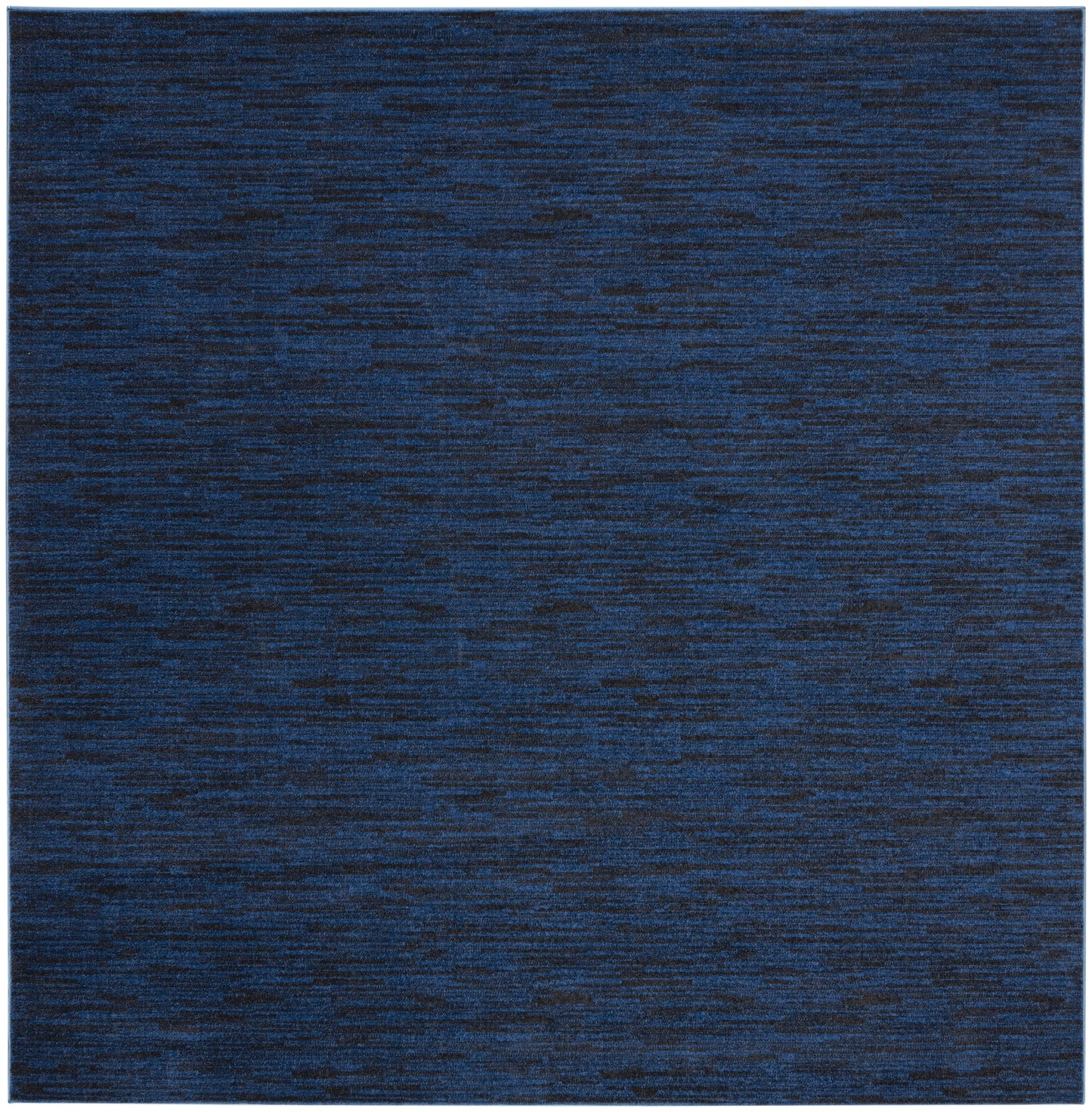 Dark blue heathered area rug with subtle marled texture; square, modern flat-weave.