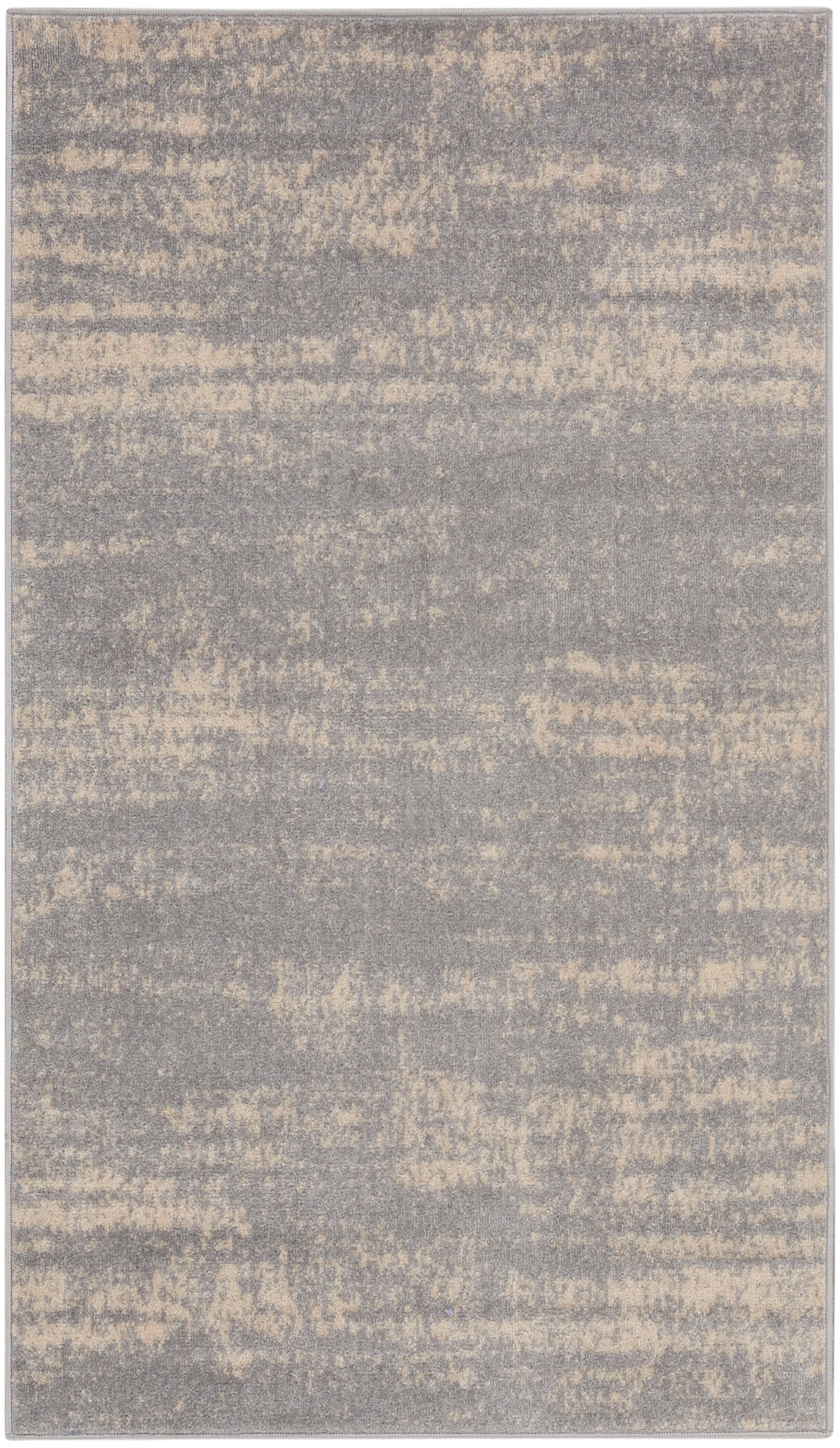 Rectangular area rug in gray with beige speckled abstract pattern; soft, plush texture and modern style.